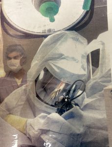 Dr. Brian Cohen performing surgery in an operating room.